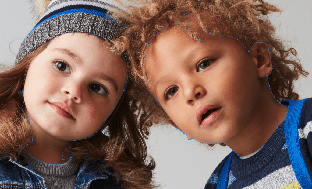 Two young children in winter hats and sweaters